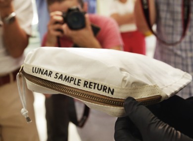 The lunar dust plus some tiny rocks were brought back by Neil Armstrong in 1969