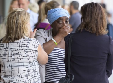 Families of victims of the Grenfell Tower fire arrive at a meeting with the police and the coroner.