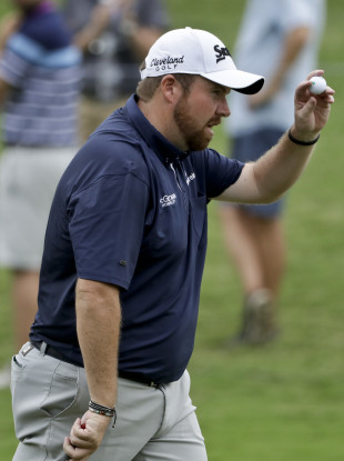 Shane Lowry of Ireland, waves on the 15th hole during the second round of the PGA Championship golf tournament at the Quail Hollow Club.