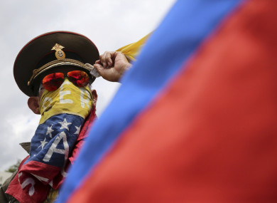 An anti-government demonstrator wearing a Russian military hat protests the government of Venezuela's President Nicolas Maduro in Caracas.