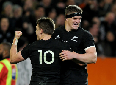 Beauden and his brother Scott Barrett celebrate a try against Australia.