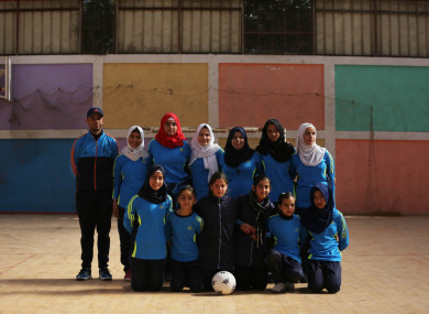 Pictured in February are young girls playing for the first time in a football championship in the Gaza Strip.