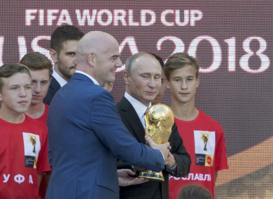 Fifa boss Gianni Infantino and Russian president Vladimir Putin with the World Cup trophy in Moscow last week.