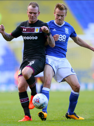 Aston Villa's Glenn Whelan (left) and Birmingham City's Maikel Kieftenbeld battle for the ball.