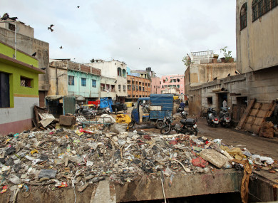 A street full of trash is pictured in Bangalore, India, in 2012.