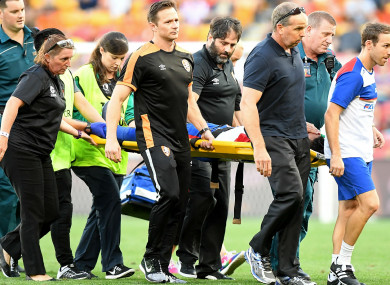 Newcastle Jets midfielder Ronald Vargas is carried away on a stretcher.