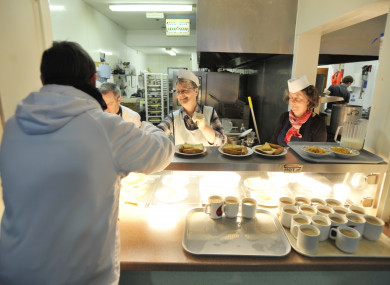 Volunteers hand out breakfast. (File, 2011)