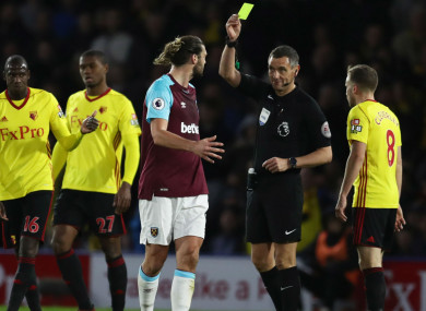 Andy Carroll is booked at Watford