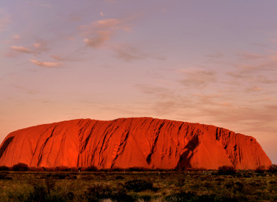 The sun sets at Uluru in the Northern Territory, Australia.