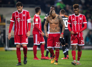 Bayern's Javi Martinez (L-R), Arturo Vidal and Kingsley Coman leave the pitch.