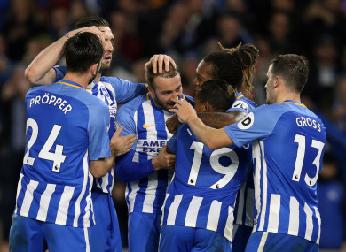 The Brighton players celebrate scoring.