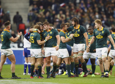 South Africa players celebrate their 18-17 victory over France.
