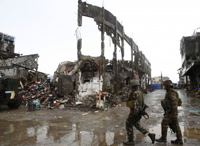 Members of Armed Forces of the Philippines patrol in Marawi.
