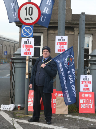 Irish Rail Revenue Protection Officer Harry Delaney from Dublin joins train drivers and rail workers picket outside Heuston Train Station in Dublin.