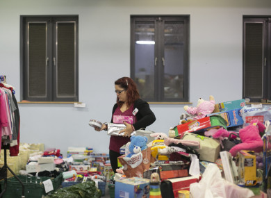 Volunteers sort out toys in Saint Vincent De Pauls Warehouse in Dublin