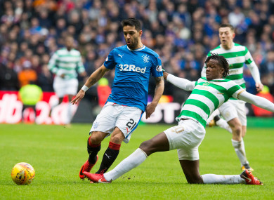 Celtic's Dedryck Boyata (right) and Rangers Daniel Candeias battle for the ball.