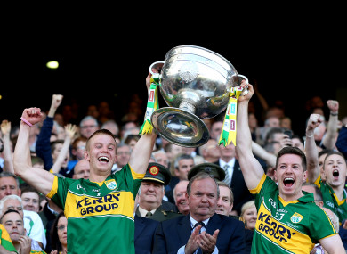 Fitzgerald lifts the Sam Maguire alongside Kieran O'Leary.