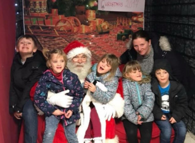 Mary Gore and her children meeting Santa this year.