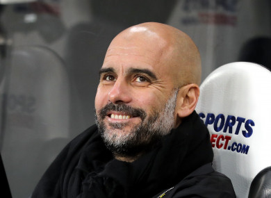 No wonder he's happy: Pep's City are 15 points clear at the top of the league.