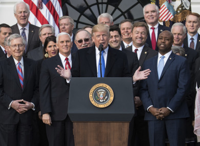 US President Donald Trump joined by members of congress speaking during an event on the South Lawn of the White House in Washington.