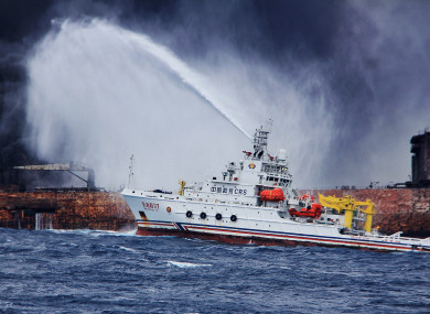 Rescuers spray foam to extinguish flames on the stricken oil tanker SANCHI off the coast of east China's Shanghai.