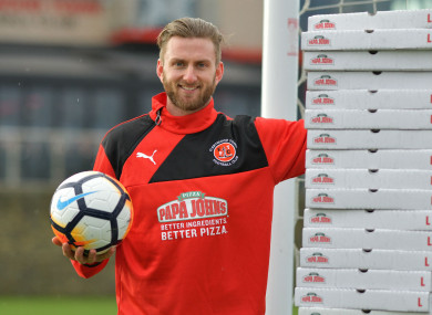 Neal pictured with his free pizzas before today's game.