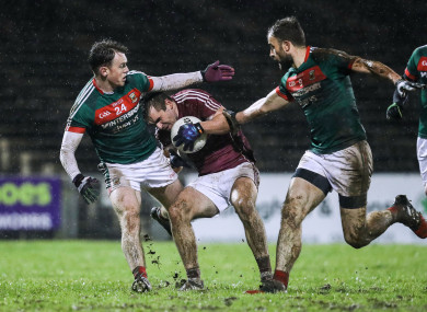 Mayo's Shane Nally and Jason Gibbons with Cathal Sweeney of Galway.
