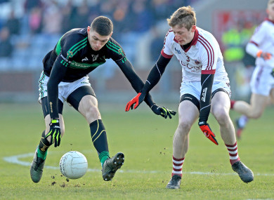 Luke Connolly and Brendan Rogers battling for possession.