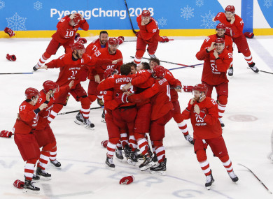 Olympic athletes from Russia celebrate after winning the men's gold medal hockey game against Germany.
