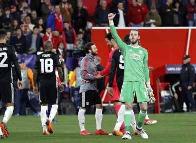 Manchester United goalkeeper David de Gea, right, gestures to the supporters at the end.