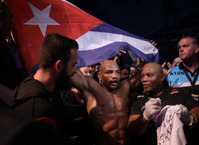 Yoel Romero celebrates his win against Luke Rockhold last night.