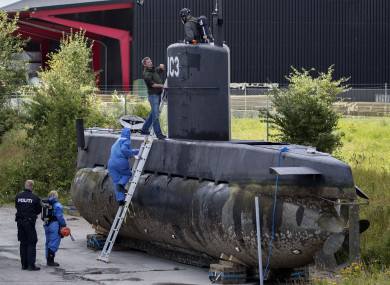 Police technicians board submarine UC3 Nautilus on a pier in Copenhagen harbor, Denmark, last August.