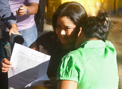 Maira Figueroa is embraced by a relative, shortly after being released from the Women's Rehabilitation centre in Ilopango, El Salvador.