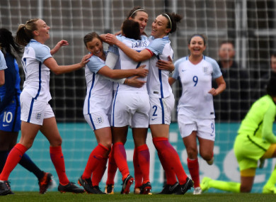 Jill Scott #8 of England celebrates her first half goal against France with teammates.