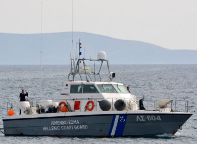 A coast guard vessel arrives at the port of Pythagorio with the bodies of people who died today