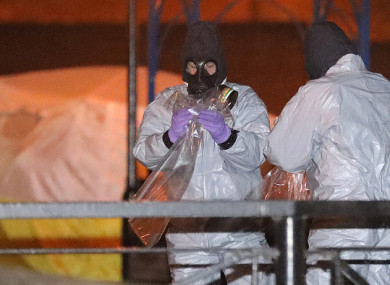 Police officers in forensics suits and protective masks work at the scene of the poisoning of Sergei Skripal.
