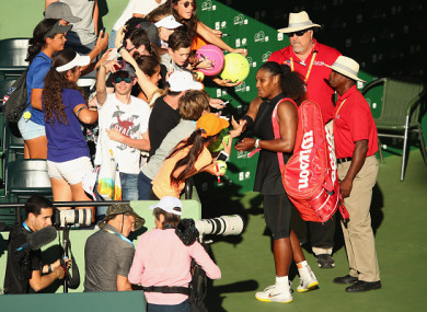Williams signs autographs after the defeat.