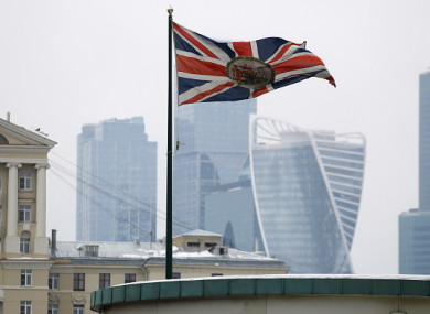 The Union Jack flag waving by the British Embassy with the towers of the Moscow International Business Centre in the background.