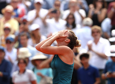 Halep celebrates victory at Roland Garros.