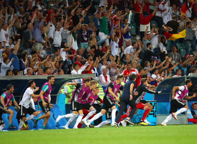 The Germany bench celebrates after Toni Kroos scored a late winner against Sweden.
