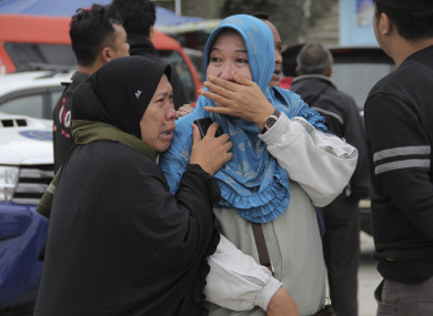Relatives grieve after learning that their families members are among the passengers of the ferry which sank