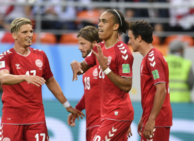 Denmark's Yussuf Yurary Poulsen, second right, celebrates with his teammates.