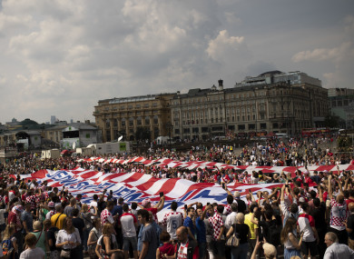 Croatia fans wave giant Croatia banners as they cheer at the Manezhnaya Square before the World Cup final.