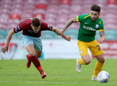 Preston's Sean Maguire with James McSweeney of Cobh Ramblers.
