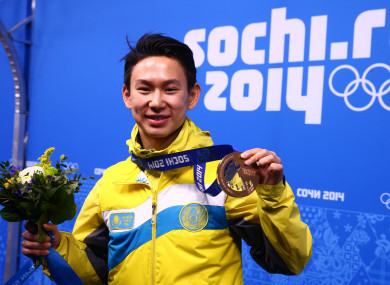 Denis Ten poses with his bronze medal at the Sochi 2014 Olympic Games.