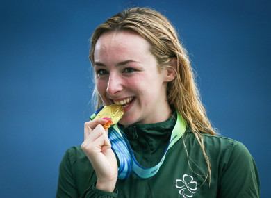 Ellen Keane celebrates receiving a gold medal in the Women's 100m Breaststroke SB8.