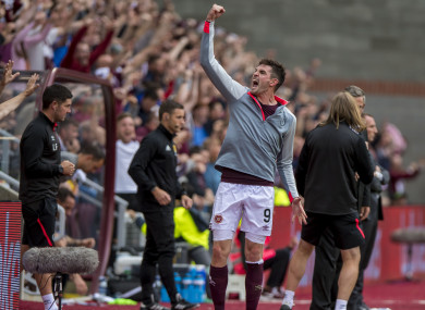 Hearts' Kyle Lafferty celebrates at full time.