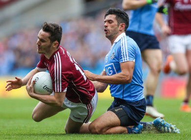 Galway's Ian Burke with Dublin's Cian O'Sullivan.