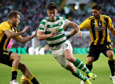 Kieran Tierney is harried during Celtic's clash with AEK Athens.