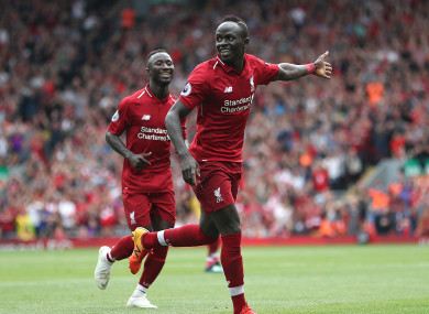 Mane celebrates scoring Liverpool's third goal.